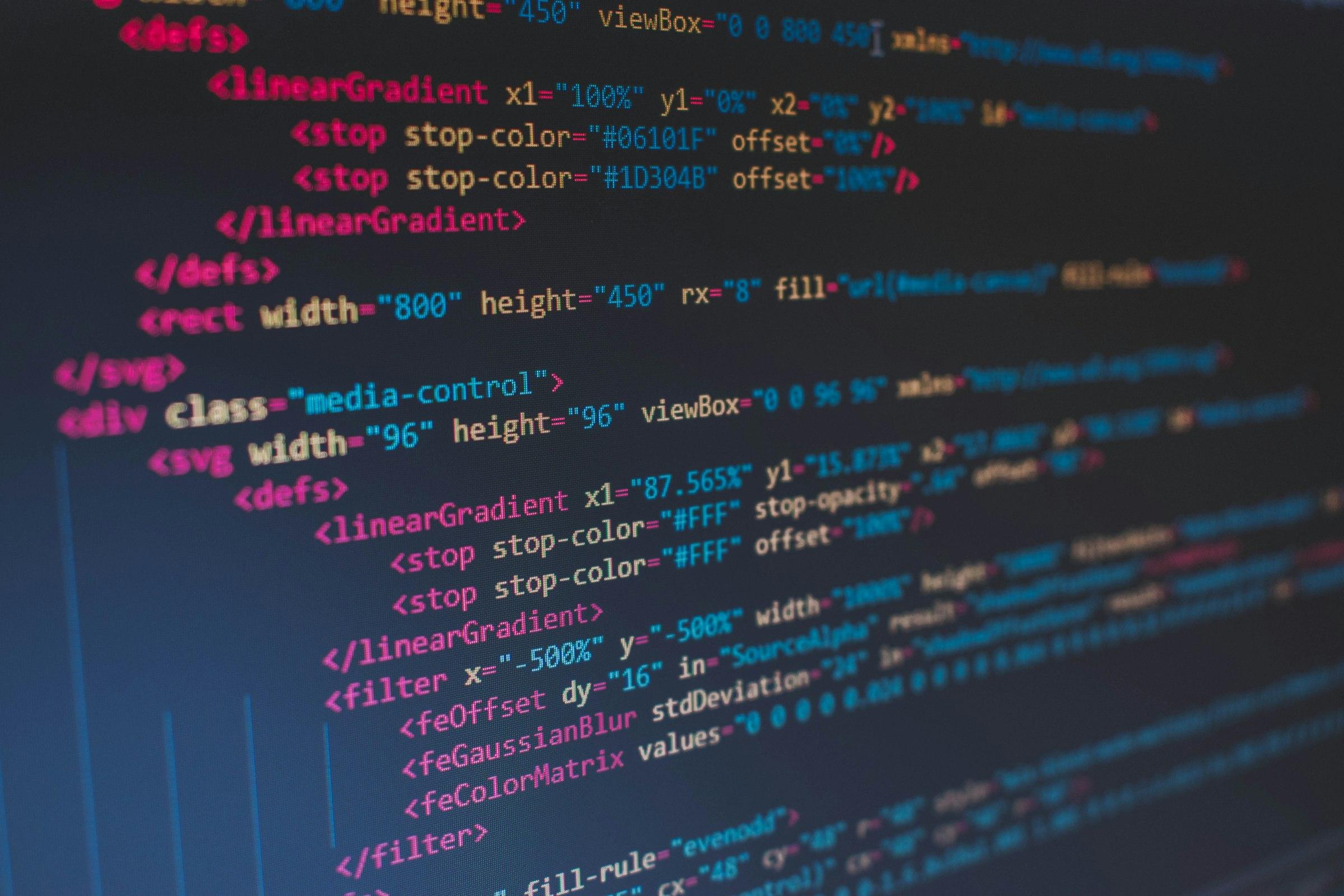 Markup and styling source code on a dark blue screen