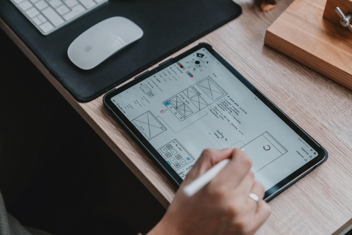 Designer crafting wireframes and visual mockups